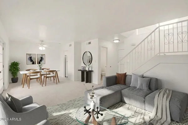 a living room with furniture and a large window