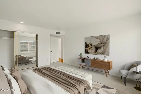 a bedroom with a bed and glass window