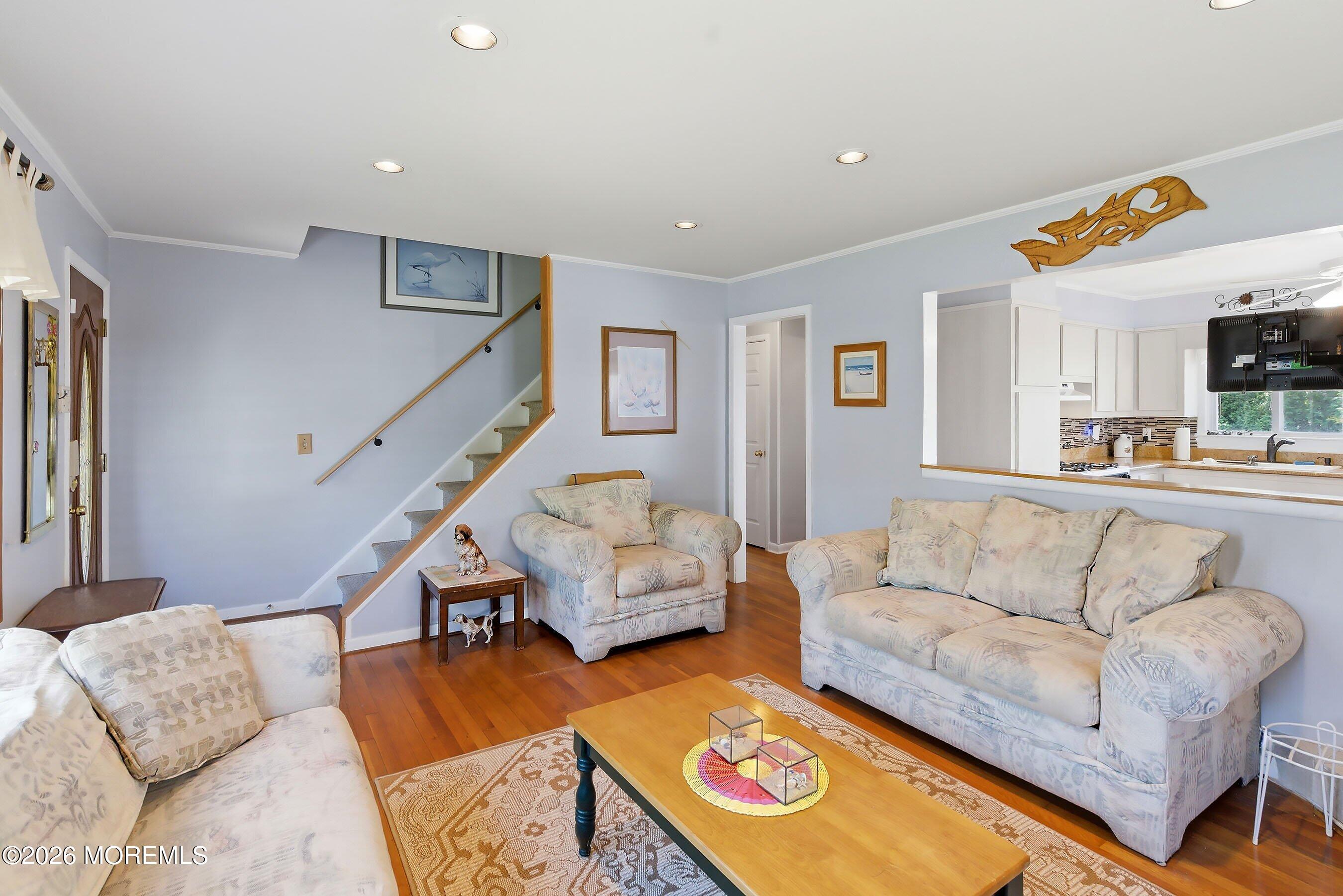 412 Moore Road Neptune Township, NJ 07753 - Photo 7 of 36 a living room with furniture and a couch