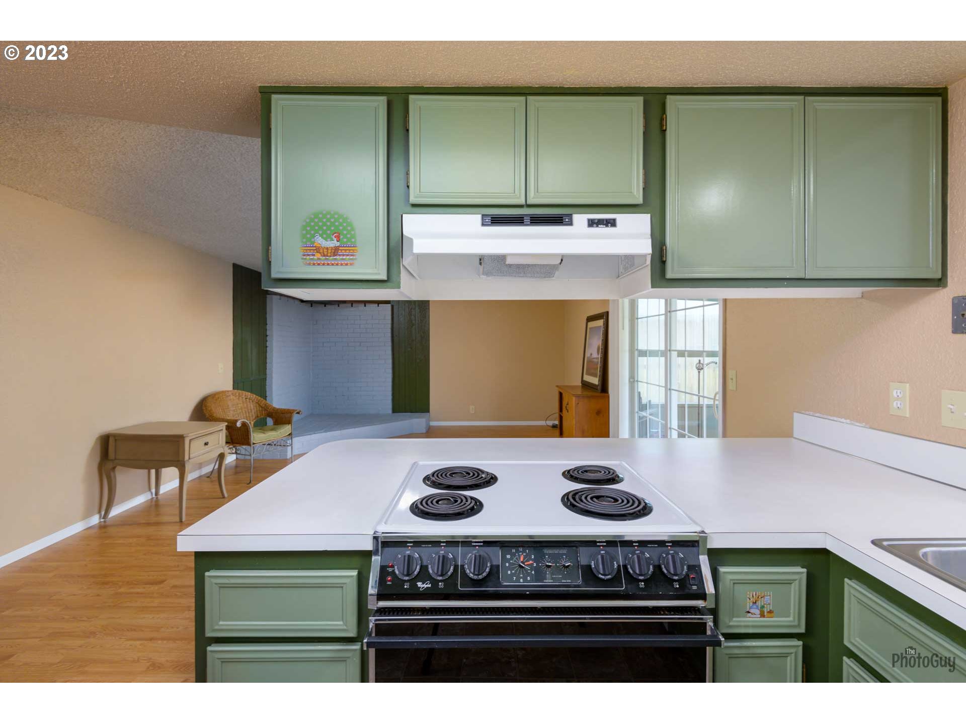 4888 B Street Springfield, OR 97478 - Photo 13 of 32 a kitchen with a stove and a cabinets