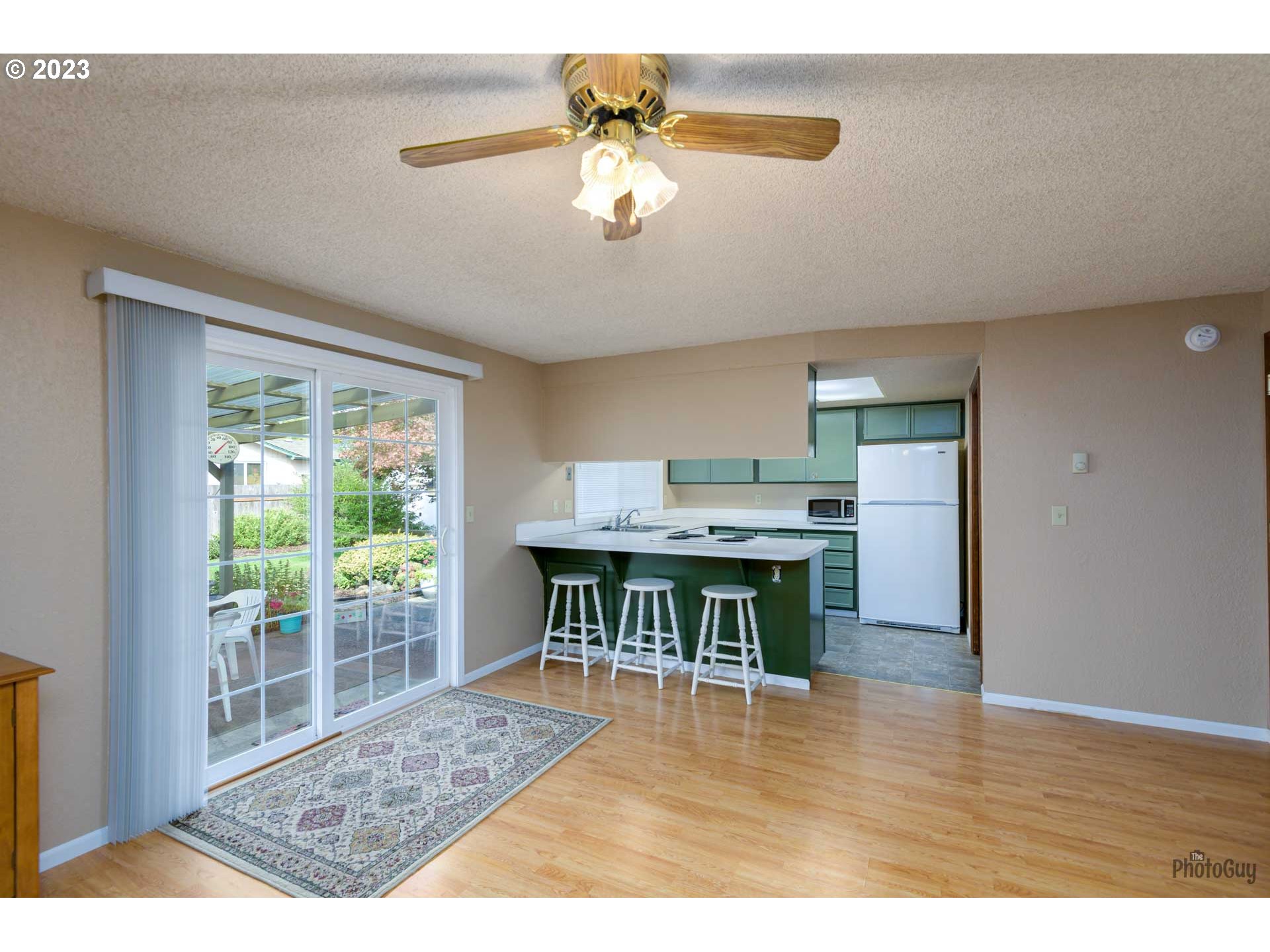 4888 B Street Springfield, OR 97478 - Photo 14 of 32 a living room with furniture and a wooden floor