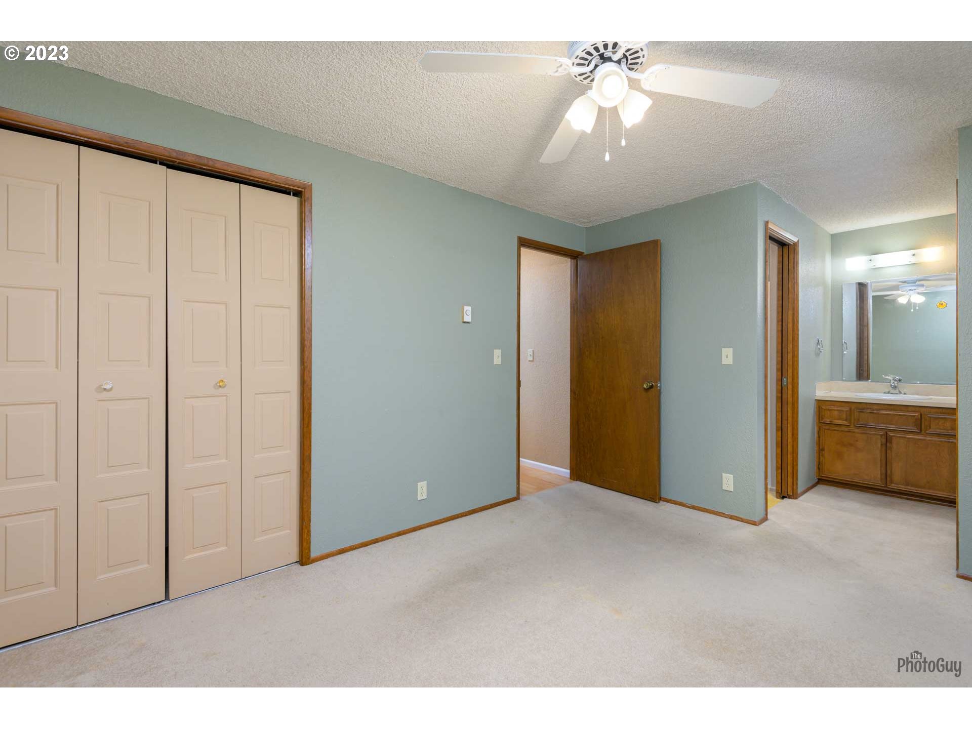 4888 B Street Springfield, OR 97478 - Photo 19 of 32 a view of a room with a chandelier fan and bathroom