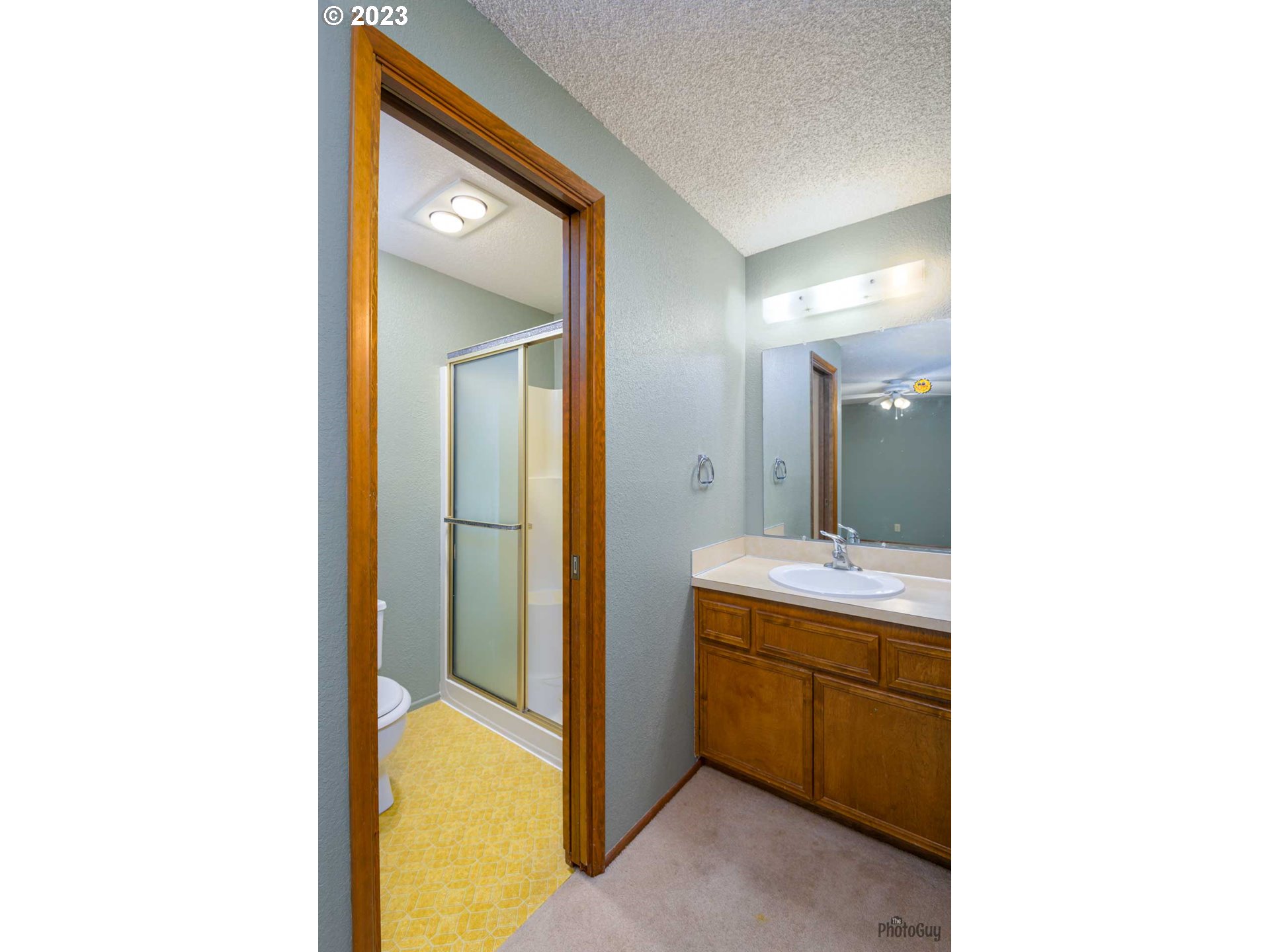 4888 B Street Springfield, OR 97478 - Photo 20 of 32 a bathroom with a sink and a mirror