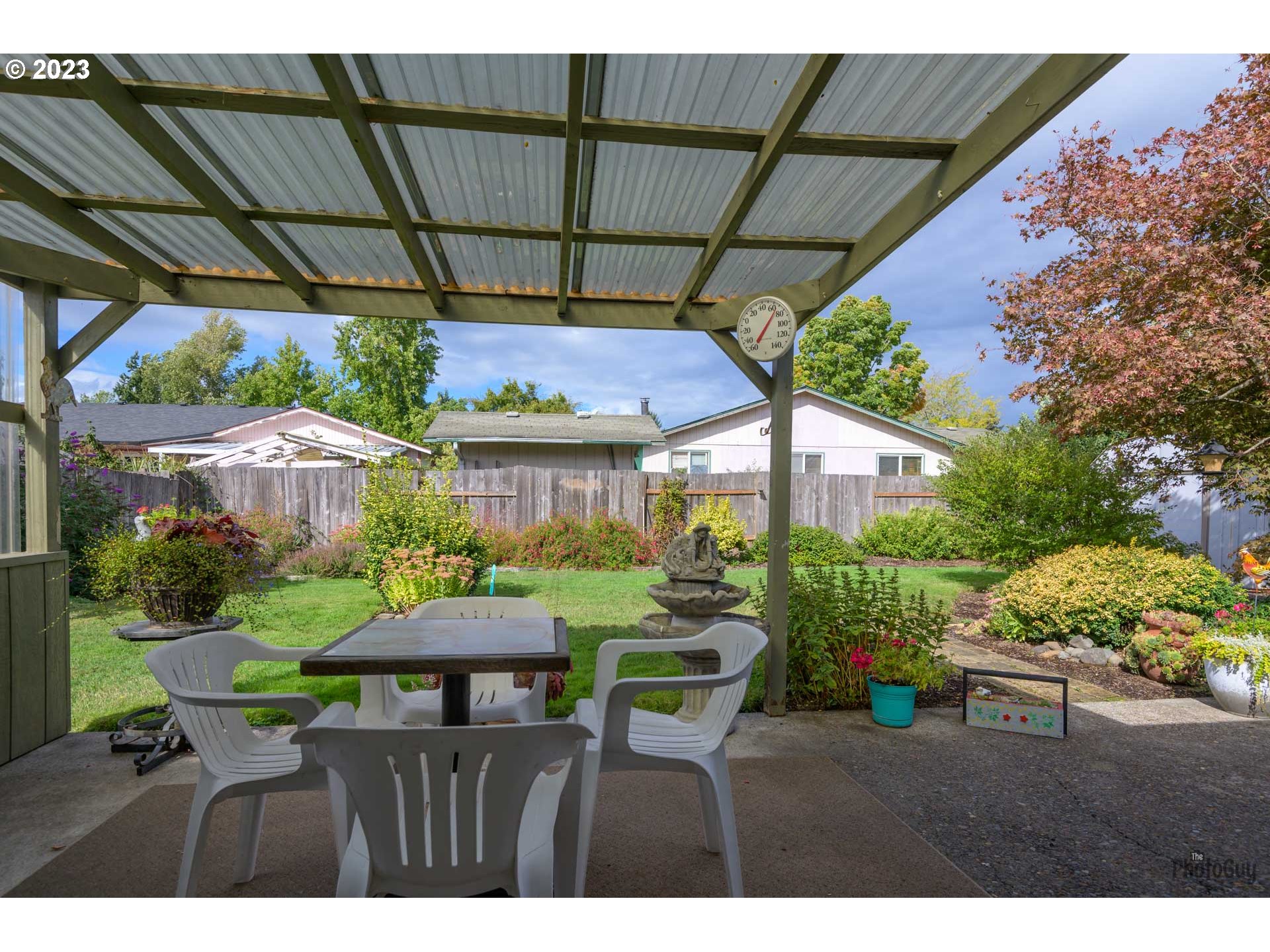 4888 B Street Springfield, OR 97478 - Photo 22 of 32 a view of a patio with furniture and a garden