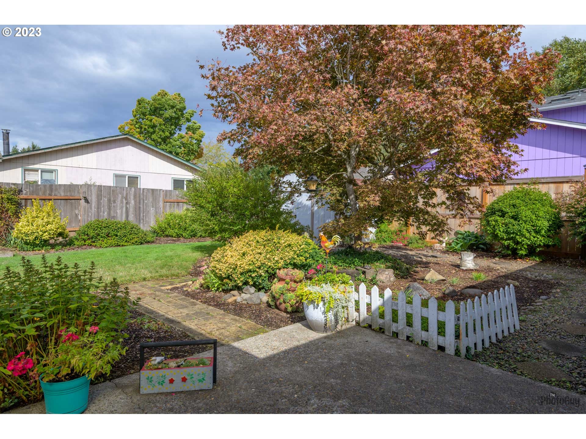4888 B Street Springfield, OR 97478 - Photo 23 of 32 a view of a backyard with potted plants