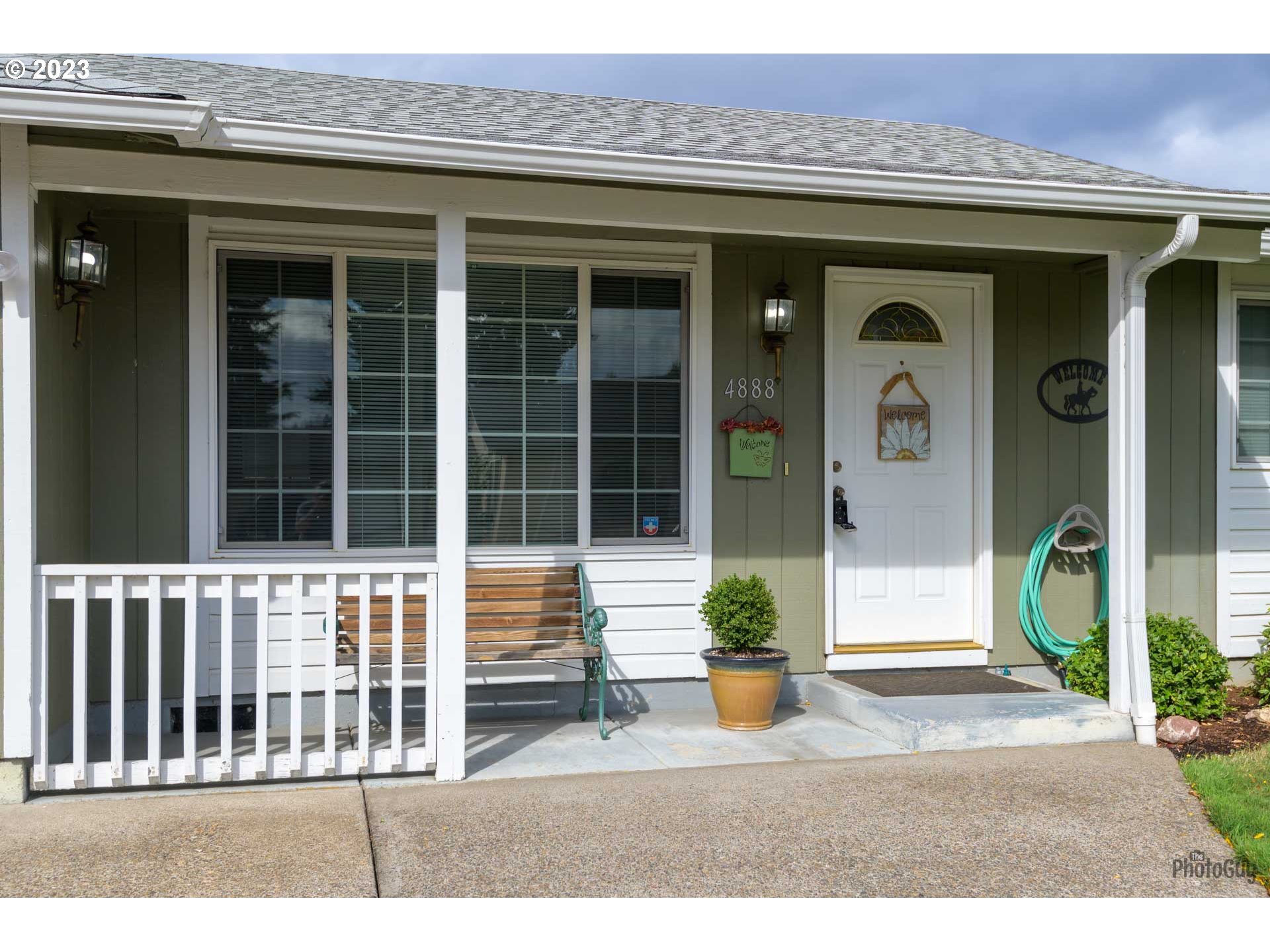 4888 B Street Springfield, OR 97478 - Photo 3 of 32 a front view of a house with a porch