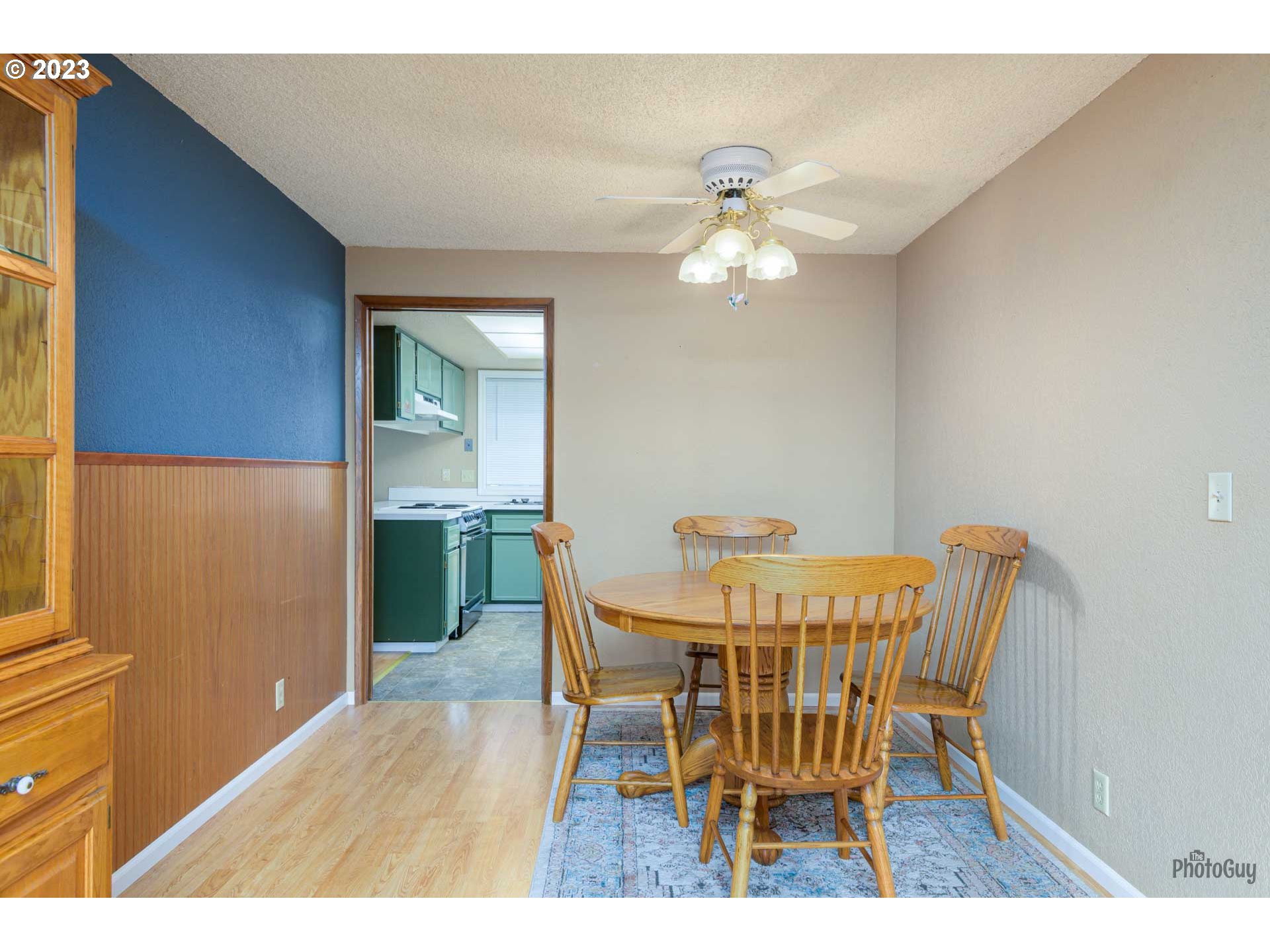 4888 B Street Springfield, OR 97478 - Photo 9 of 32 a view of a dining room with furniture and wooden floor
