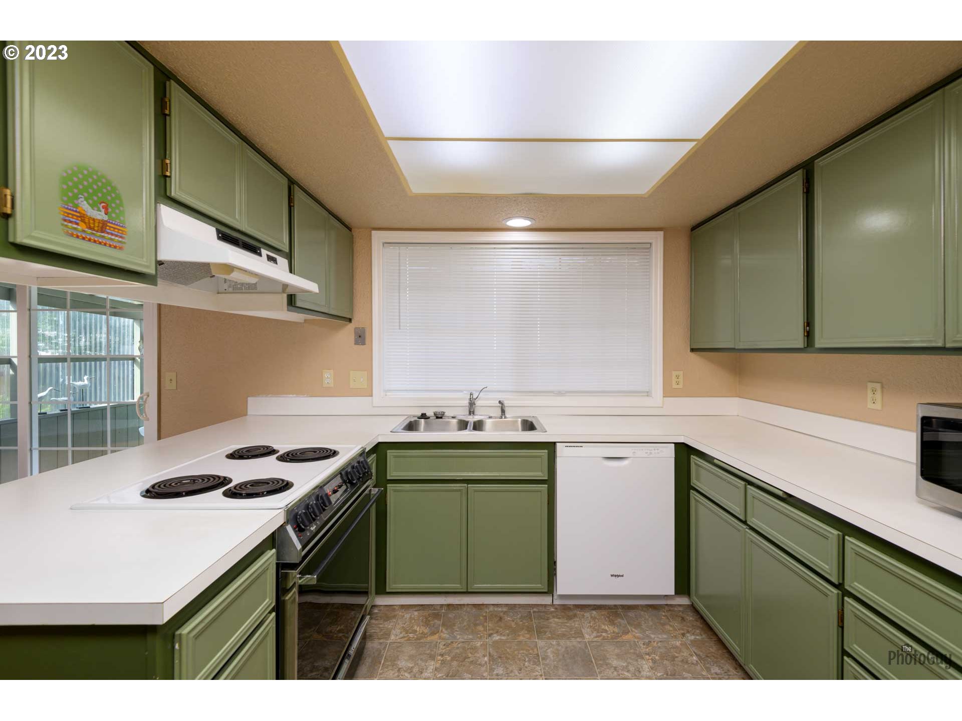 4888 B Street Springfield, OR 97478 - Photo 10 of 32 a kitchen with a sink and cabinets