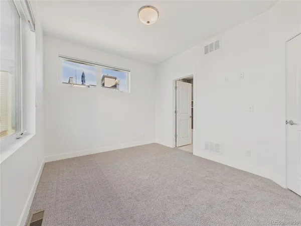 an empty room with shelves
