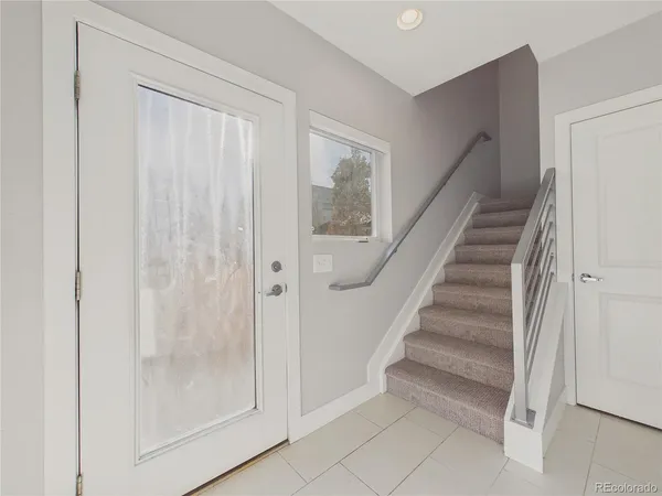 a view of entryway with wooden floor