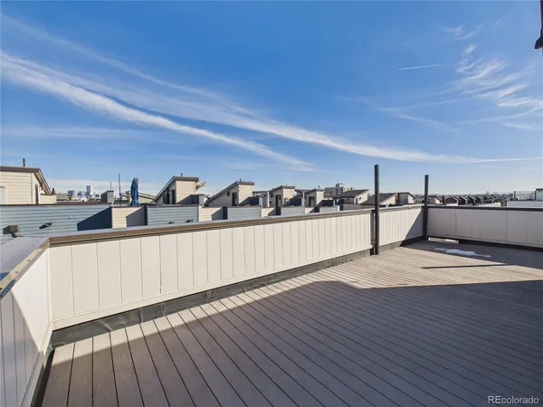 a view of a room with wooden floor and white walls