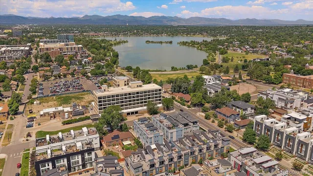 an aerial view of residential building with parking