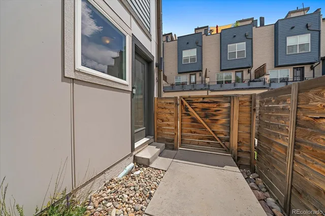 a view of a brick buildings with entryway doors