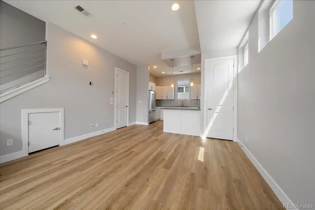 a view of a kitchen from the hallway