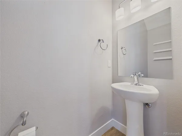 a bathroom with a sink a mirror and shower
