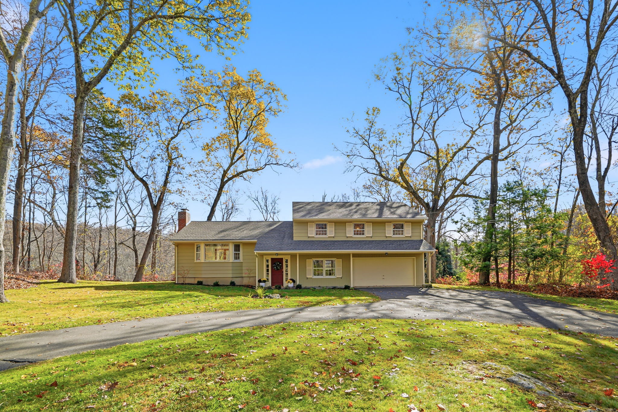 4 Orchard Drive Redding, CT 06896 - Photo 1 of 1 a view of a house with a yard and large trees