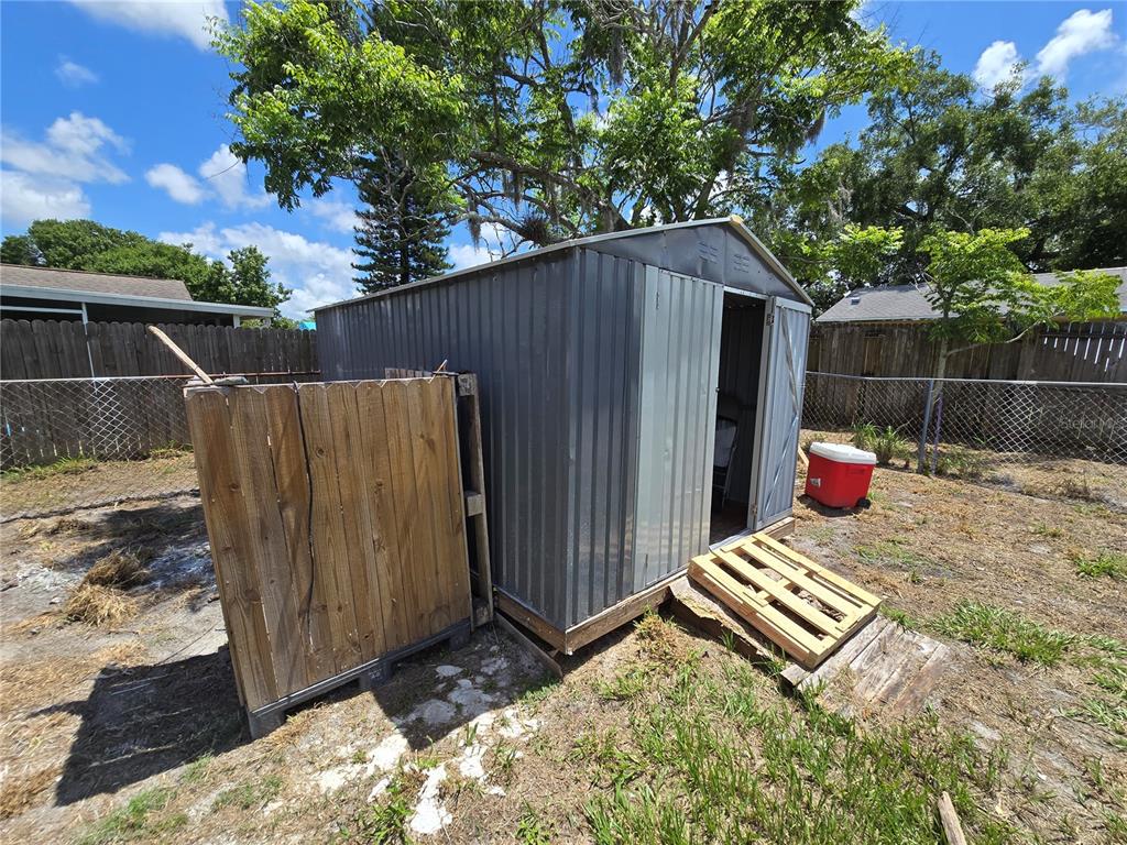 3406 Murrow Street New Port Richey, FL 34655 - Photo 20 of 21 a backyard of a house with lots of green space