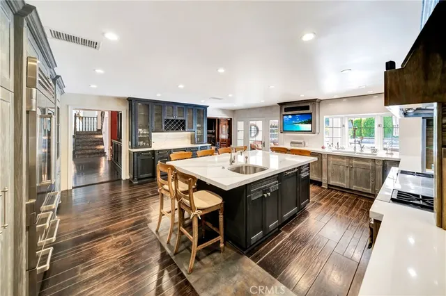 a kitchen with a stove oven and sink