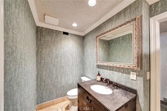 a view of a bedroom with furniture and wooden floor