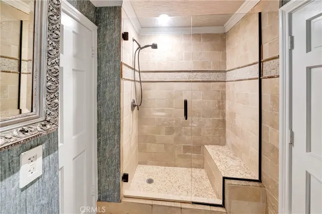 a view of staircase with railing and white walls