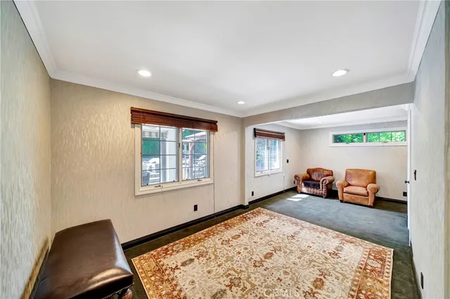 a view of empty room with wooden floor and window