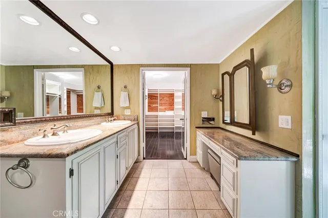 a view of a house with pool and chairs