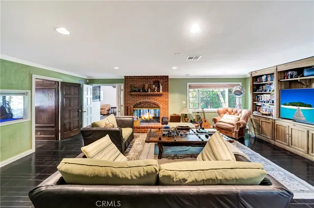 a bathroom with a granite countertop toilet sink and mirror