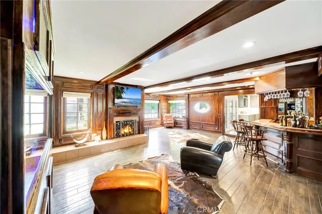 a living room with lots of furniture and large windows