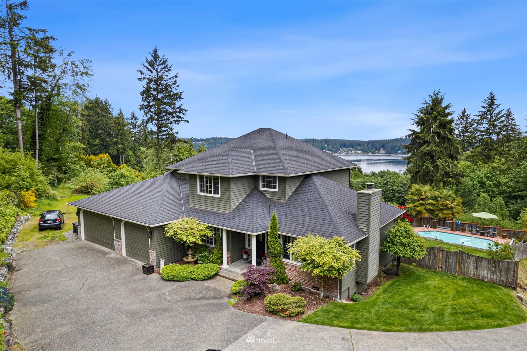 538 Eagle Ridge Road Fox Island, WA 98333 - Photo 1 of 1 an aerial view of a house with a garden and plants