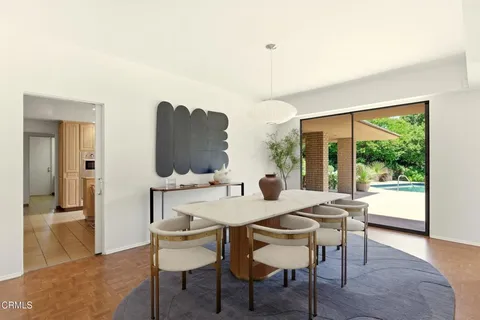 a view of a dining room with furniture window and wooden floor