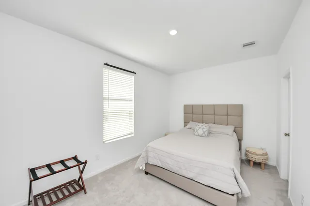 a bathroom with a sink toilet vanity and bathtub