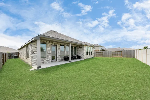 a view of a backyard with garden