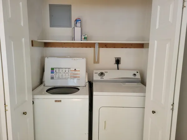 a utility room with dryer and washer