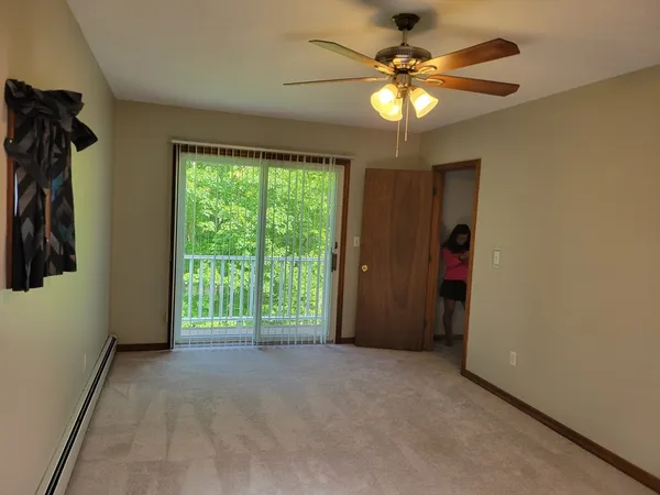 a view of an empty room with a window