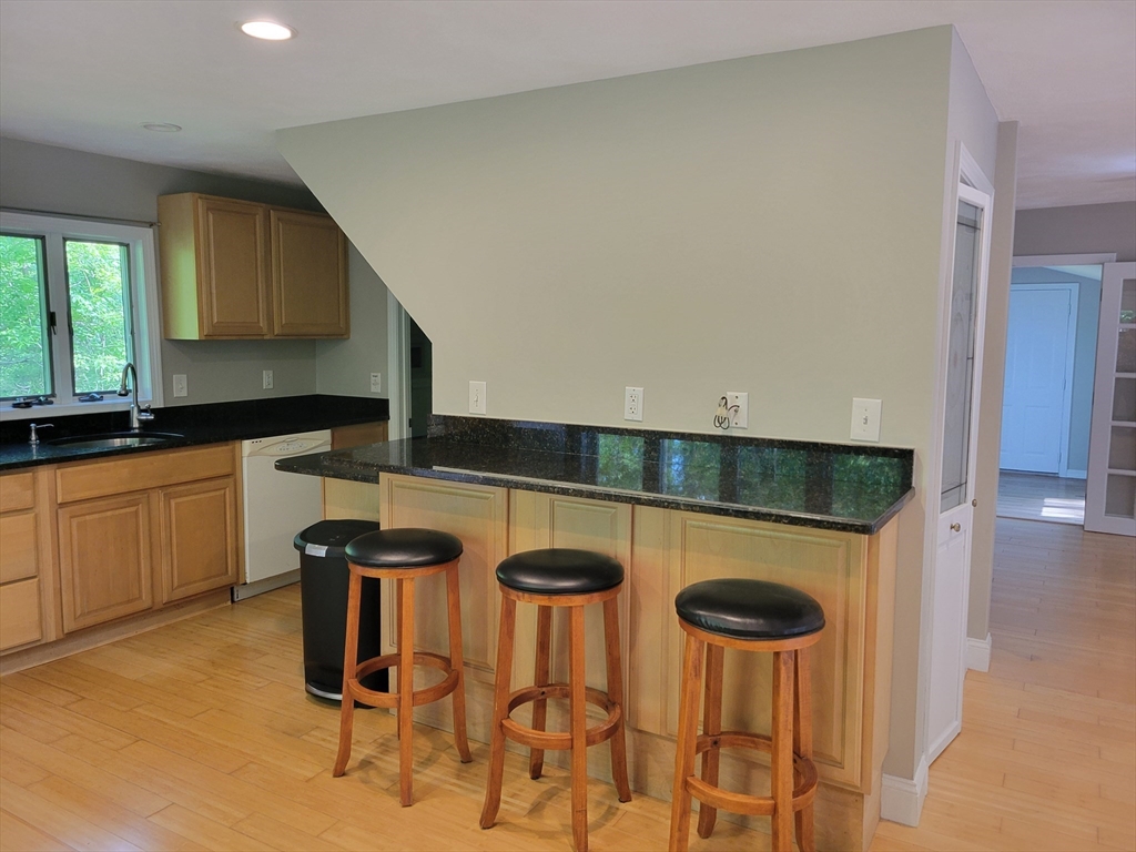 37 Golden Hills Road, Unit 37 Saugus, MA 01906 - Photo 4 of 22 a kitchen with a table and chairs in it