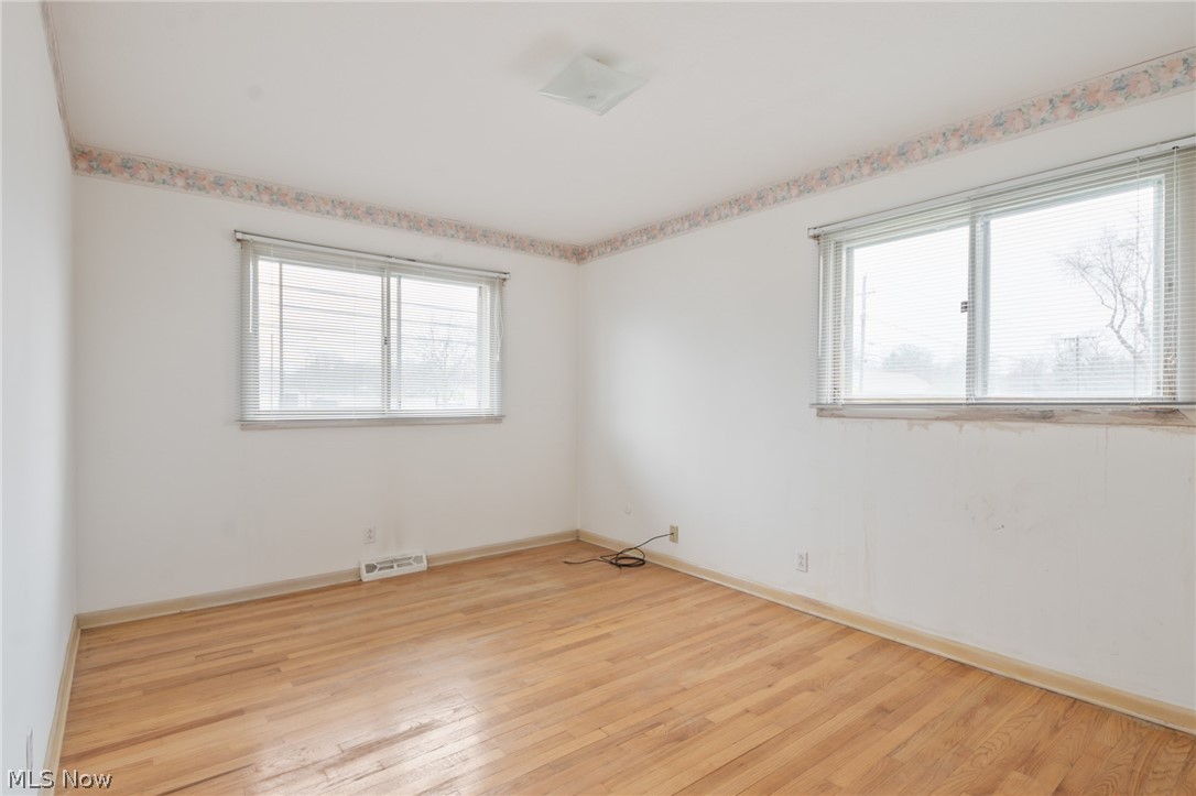 28879 Ridge Road Wickliffe, OH 44092 - Photo 16 of 34 Spare room featuring plenty of natural light and light hardwood / wood-style flooring