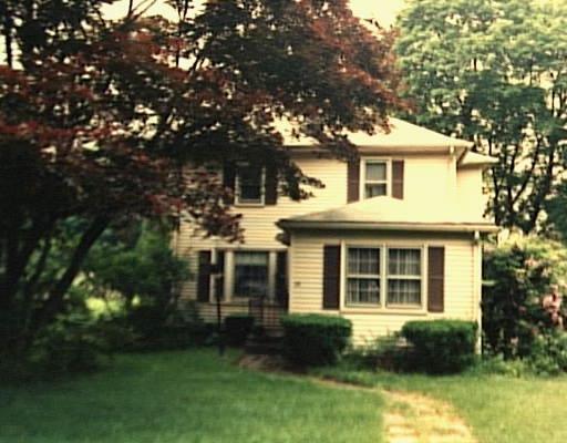 130 Compo Road South Westport, CT 06880 - Photo 1 of 1 a front view of a house with a yard and porch