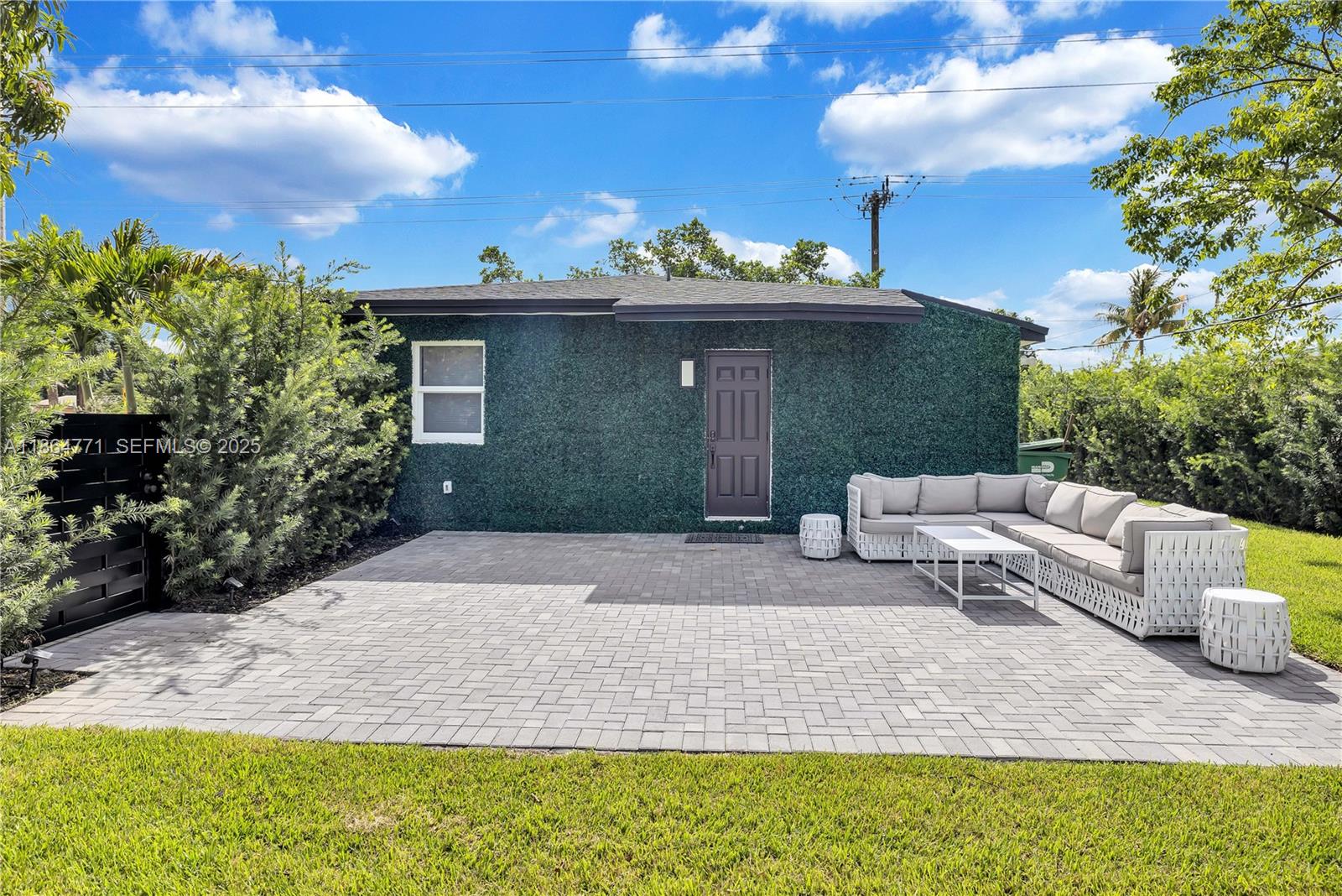 1390 Northeast 150th Street Miami, FL 33161 - Photo 25 of 32 a view of a yard with furniture