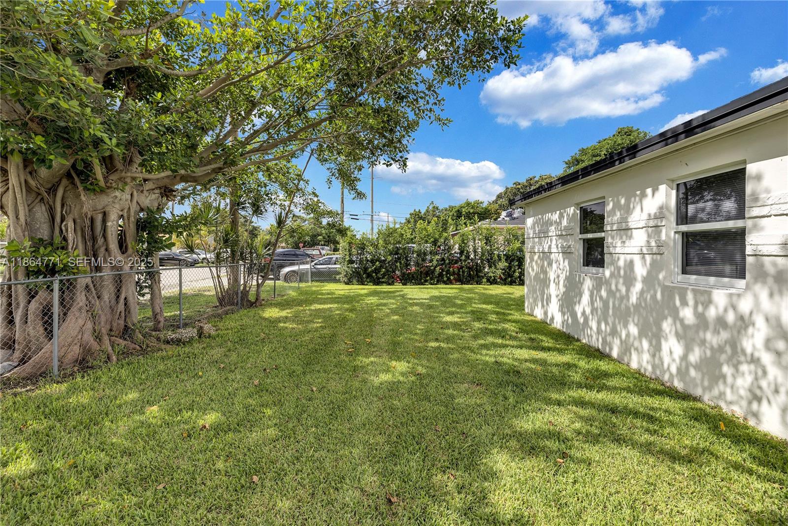 1390 Northeast 150th Street Miami, FL 33161 - Photo 29 of 32 a view of a house with a yard