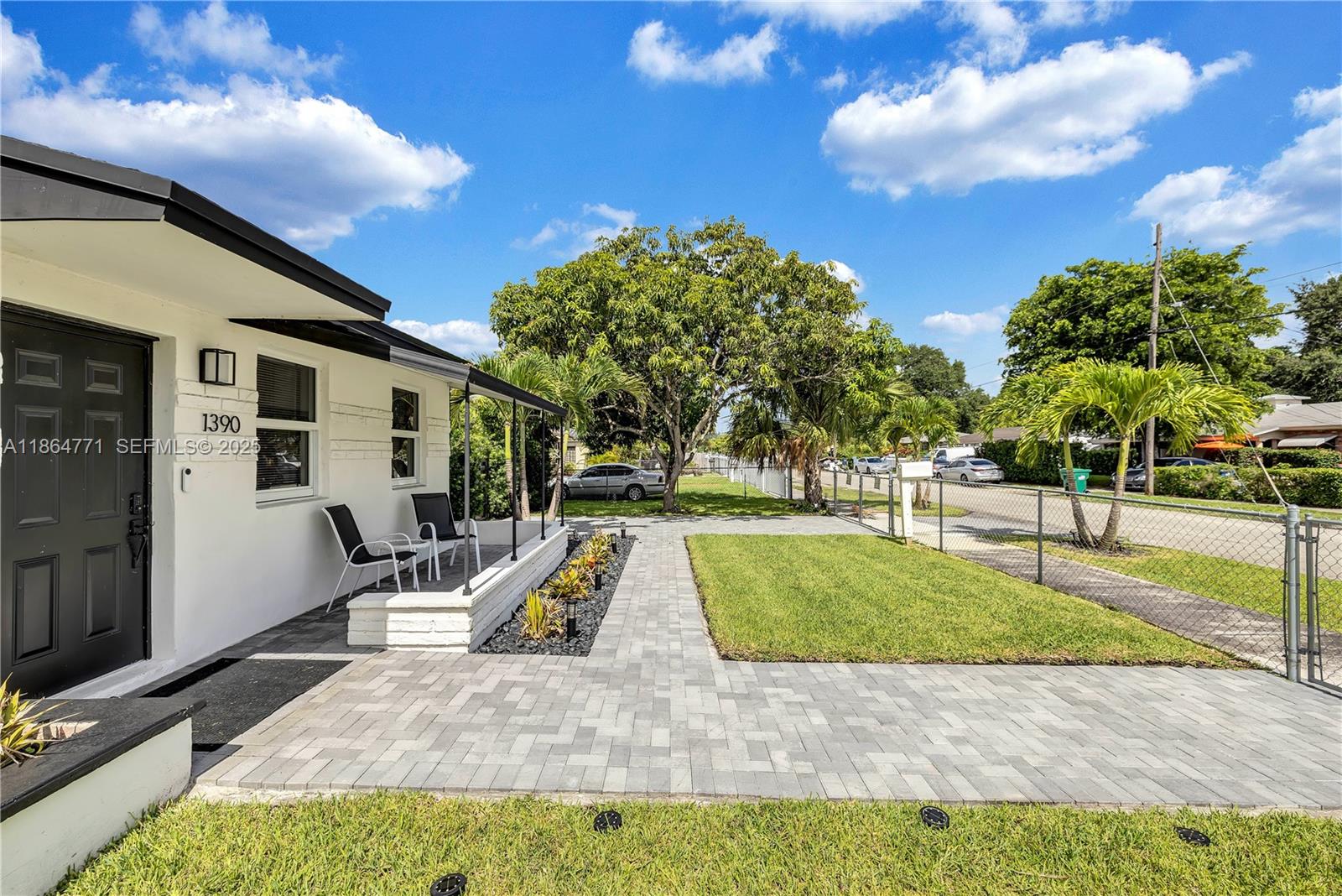 1390 Northeast 150th Street Miami, FL 33161 - Photo 31 of 32 a view of a swimming pool with a patio