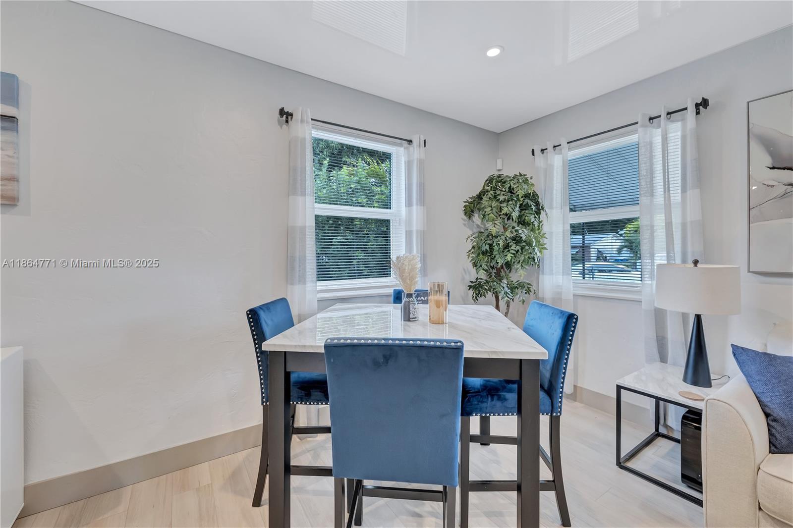 1390 Northeast 150th Street Miami, FL 33161 - Photo 4 of 31 a view of a dining room with furniture and window