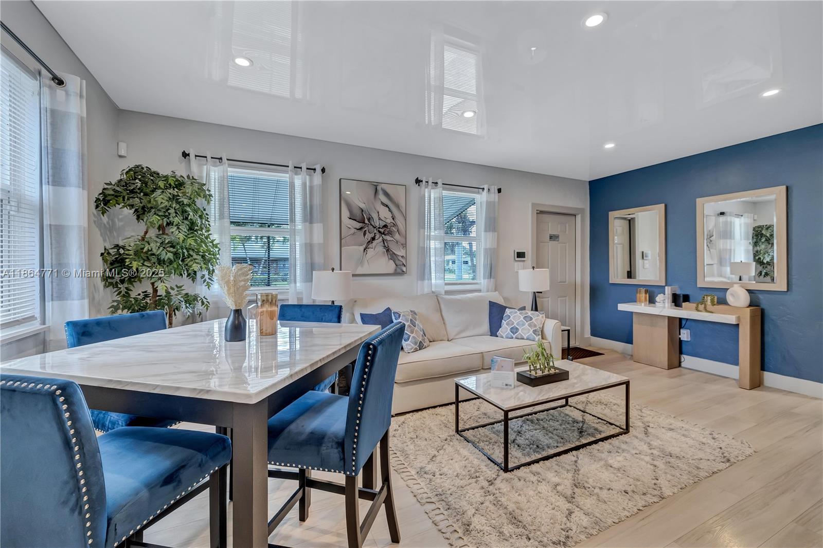 1390 Northeast 150th Street Miami, FL 33161 - Photo 5 of 31 a living room with furniture and a potted plant