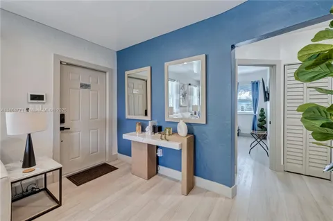a view of a livingroom with furniture and hardwood floor