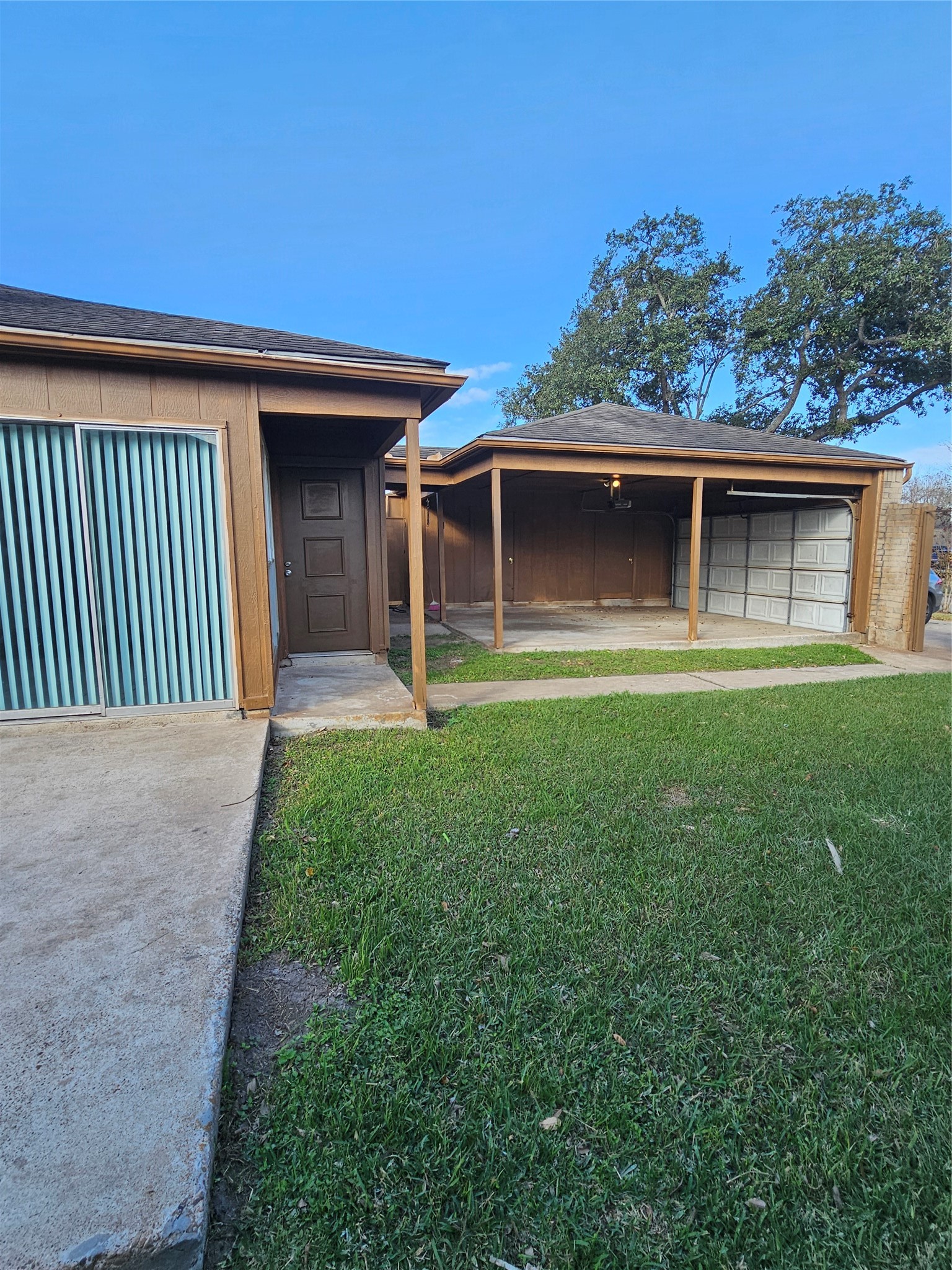 8151 Misty Ridge Lane Houston, TX 77071 - Photo 13 of 15 a front view of a house with a yard and garage