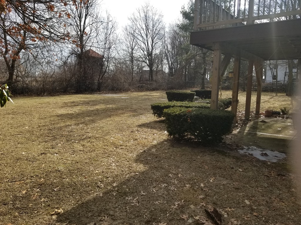22 Wyman Road Billerica, MA 01821 - Photo 28 of 29 a view of backyard with table and chairs and potted plants