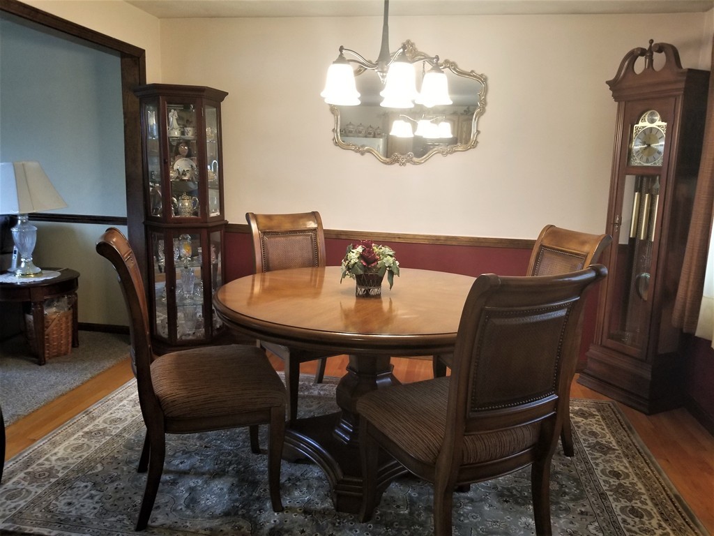 22 Wyman Road Billerica, MA 01821 - Photo 3 of 29 a view of a dining room with furniture and chandelier