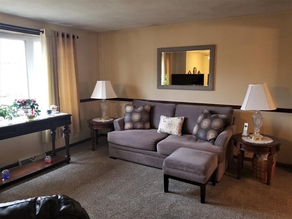 22 Wyman Road Billerica, MA 01821 - Photo 6 of 29 a living room with furniture and window