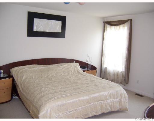 3 Webster Court Monroe, NY 10950 - Photo 12 of 25 a bedroom with a bed and a window