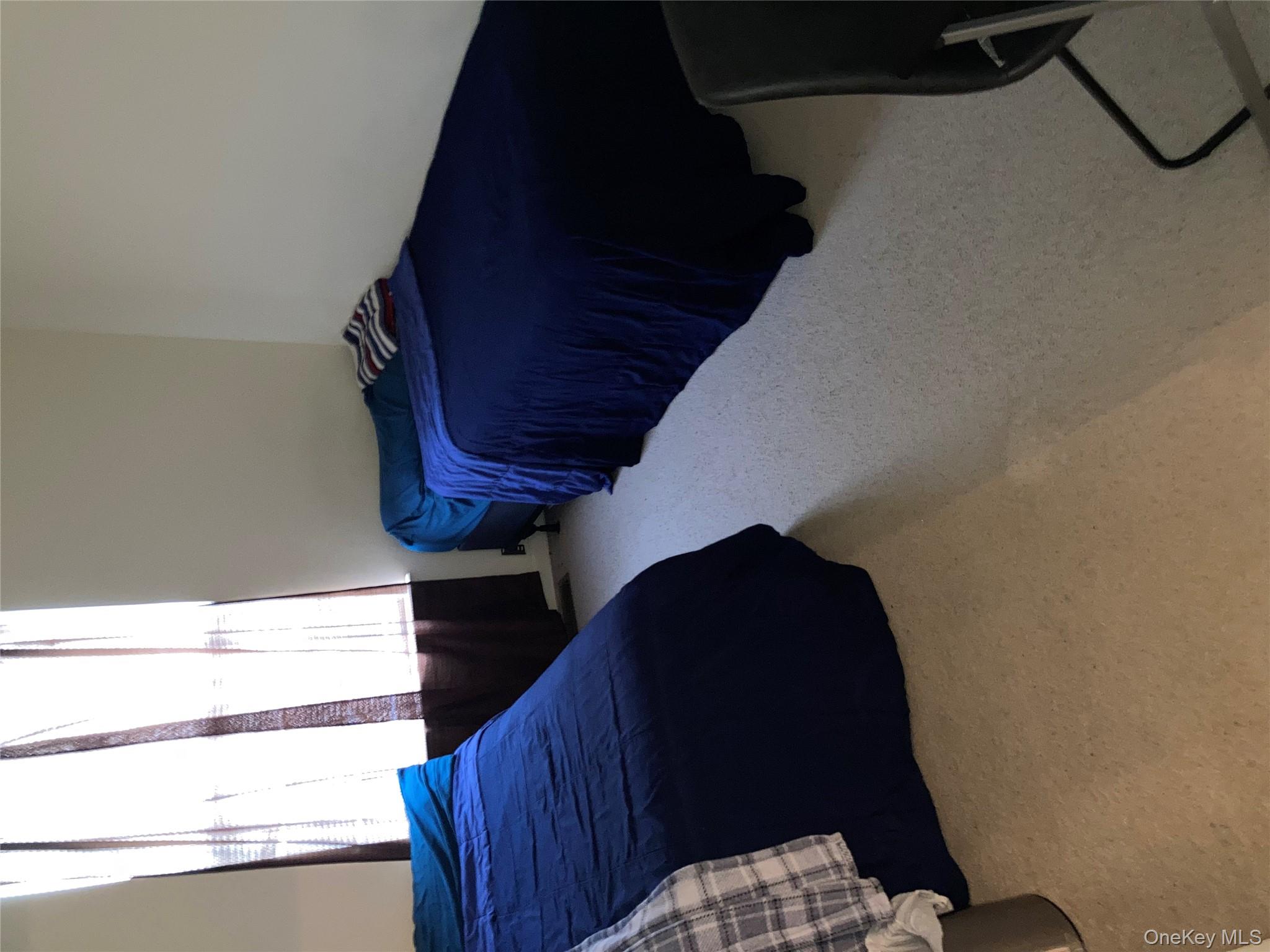 3 Webster Court Monroe, NY 10950 - Photo 17 of 25 a bedroom with a bed and a window