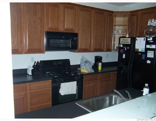 3 Webster Court Monroe, NY 10950 - Photo 2 of 25 a kitchen with granite countertop a sink and a stove top oven